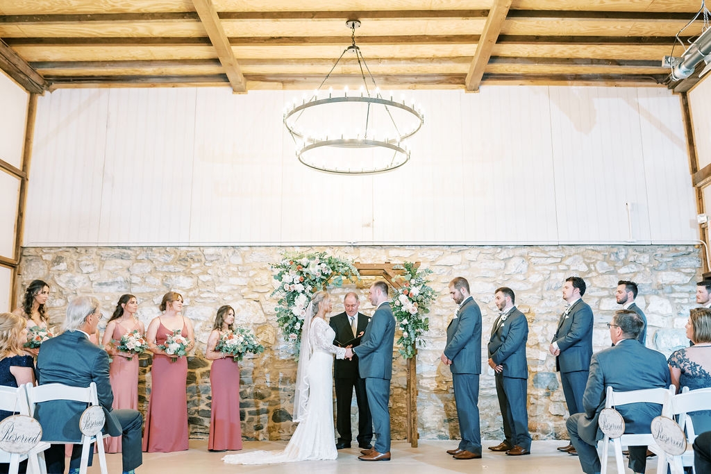An indoor ceremony at the Tobacco Barn of Melhorn Manor