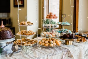 A buffet table full of assorted desserts.